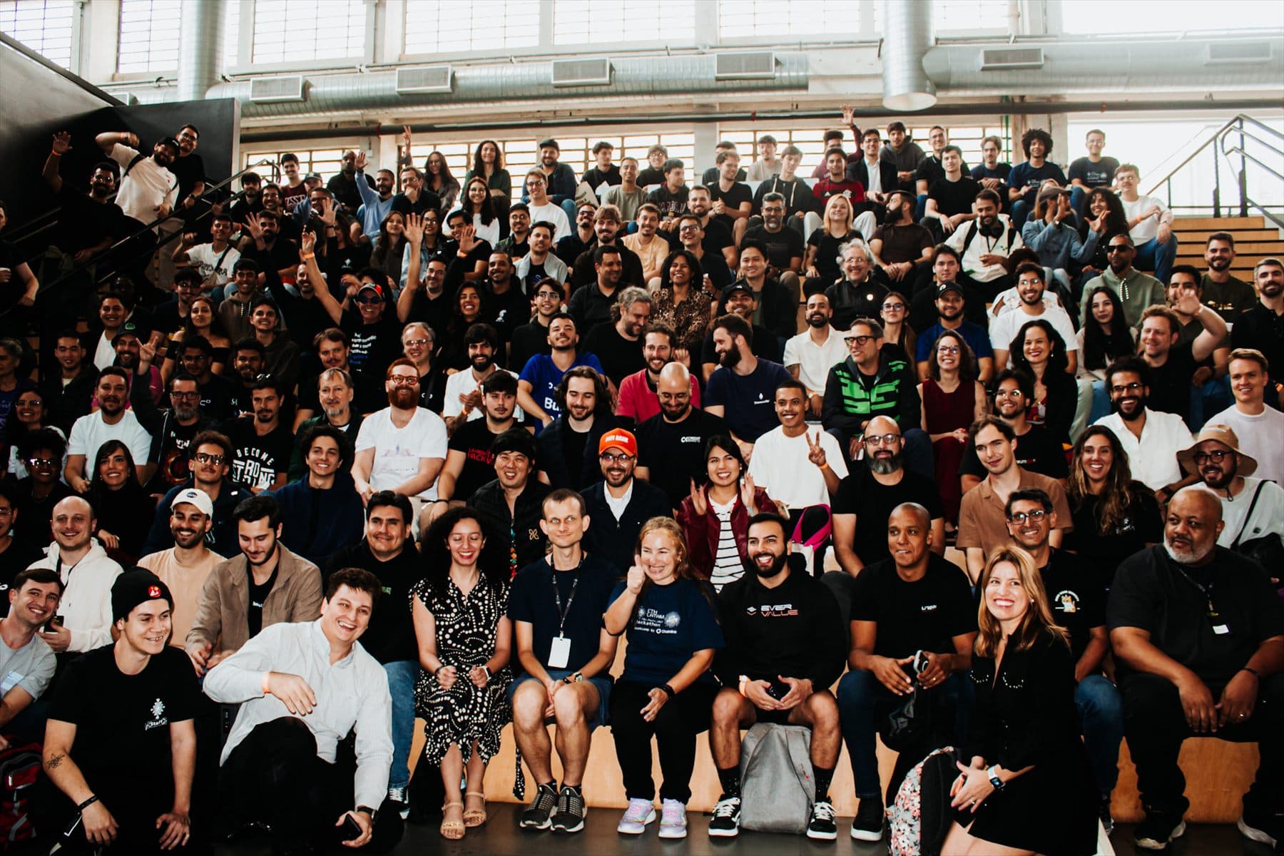 A large group of the Vellahub community gathered in an auditorium